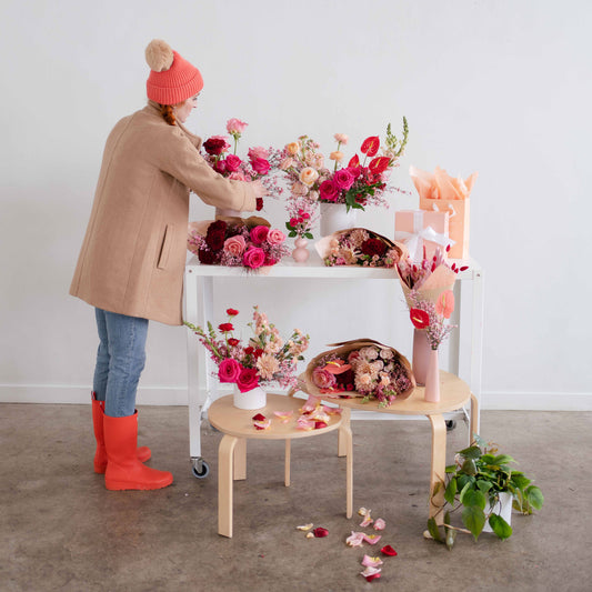 Meg styling flowers at Valentine's Day photoshoot