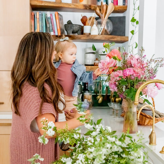 Mother and child with peony flowers