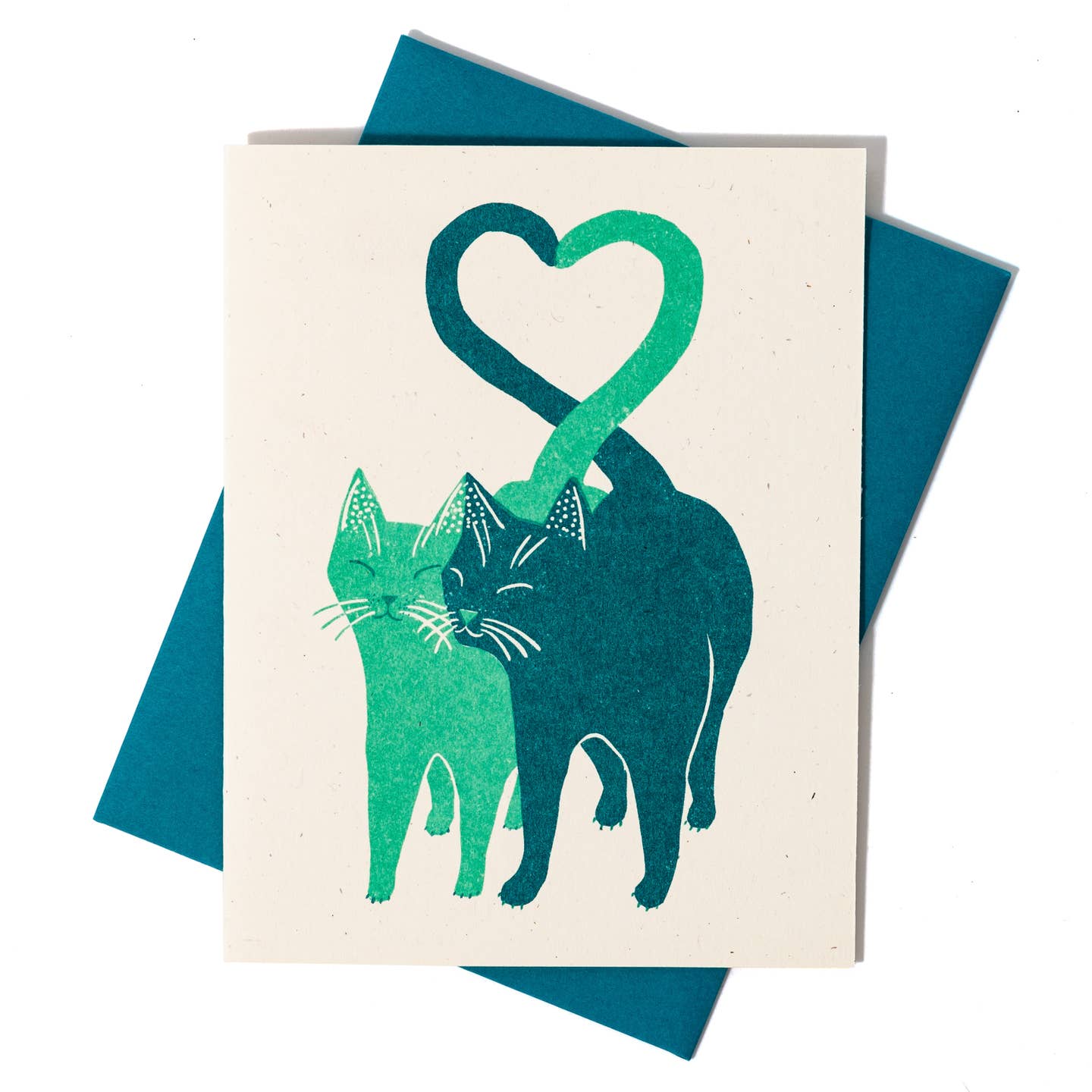 Card with green and blue cats forming a heart shape on a white background