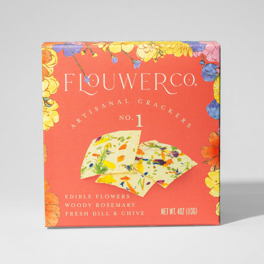 Flowerco artisanal crackers packaging with floral design on a red background