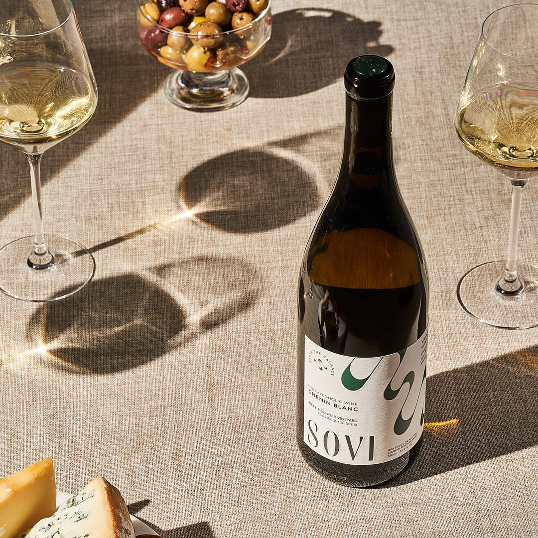 Chenin Blanc Non-Alcoholic Wine with glasses and olives
