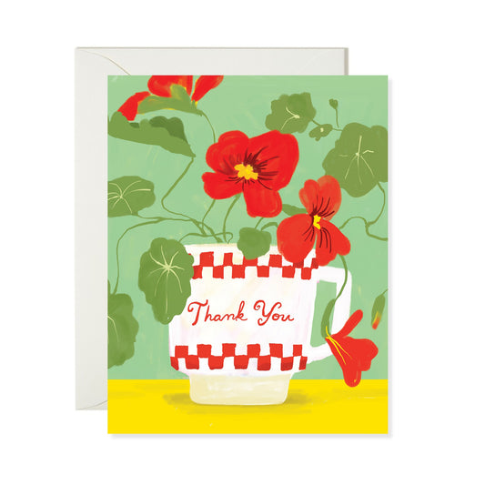 Greeting card with red flowers in a checkered cup and 'Thank You' text on a green background.