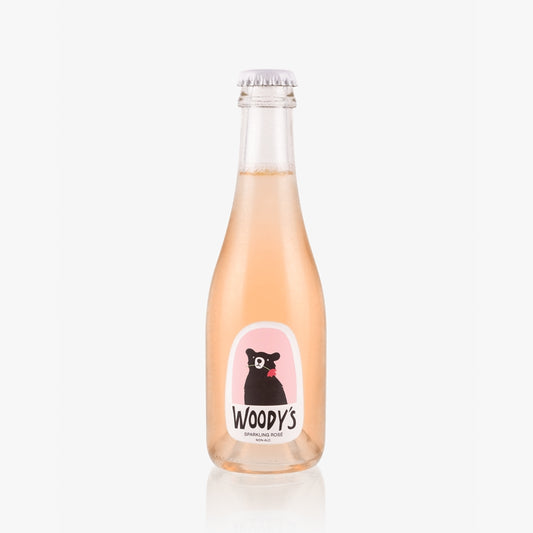 Mini bottle of Woody's sparkling rose on a white background