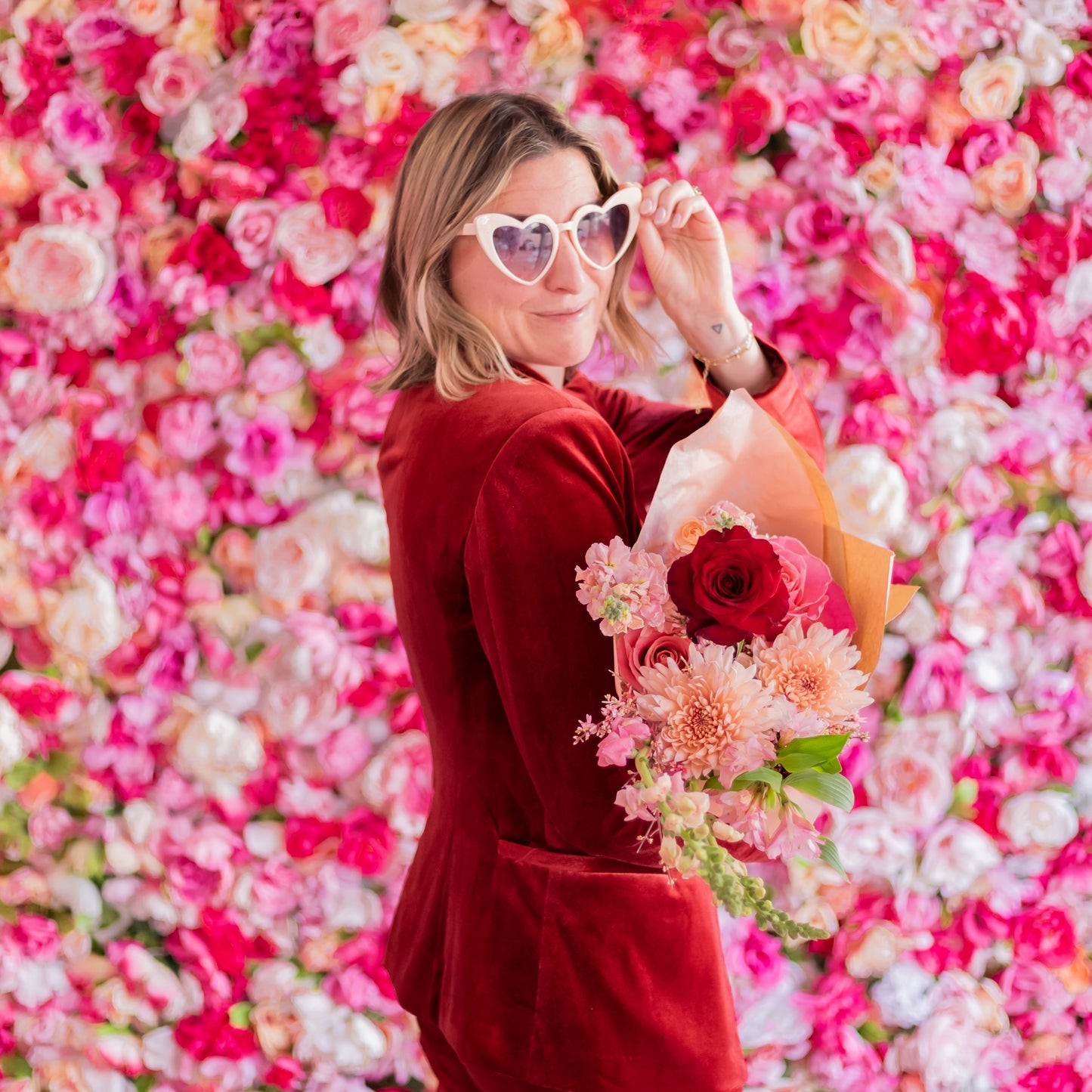 Natalie Gill holds Valentine's Day flowers from Native Poppy