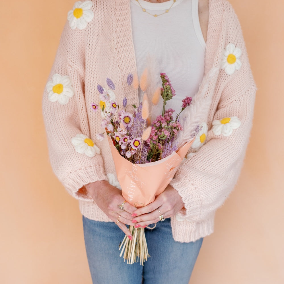 Woman holds dried flowers - mother's day flowers from Native Poppy