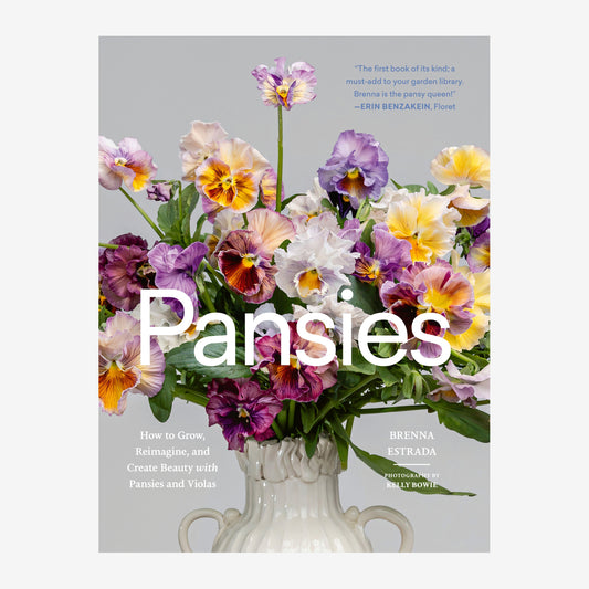 Book cover of 'Pansies' by Brenna Estrada with a vase of colorful pansies on a gray background