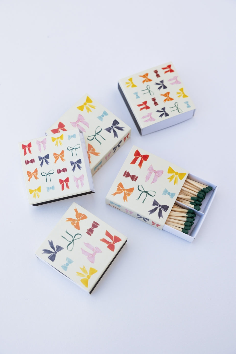 matchboxes with colorful bow pattern