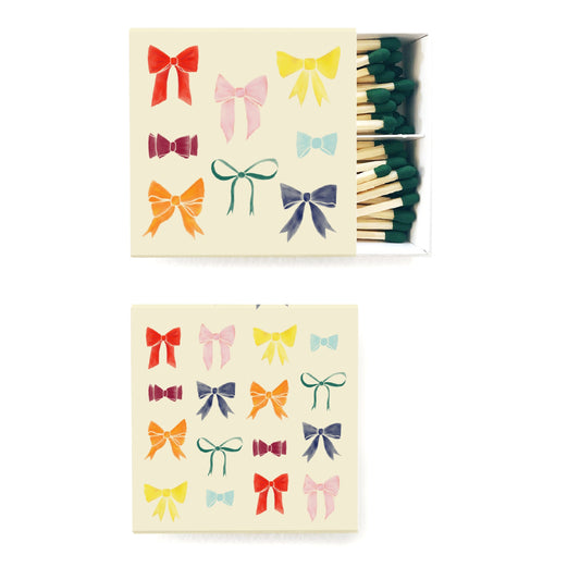 Matches with colorful bow designs on a white background