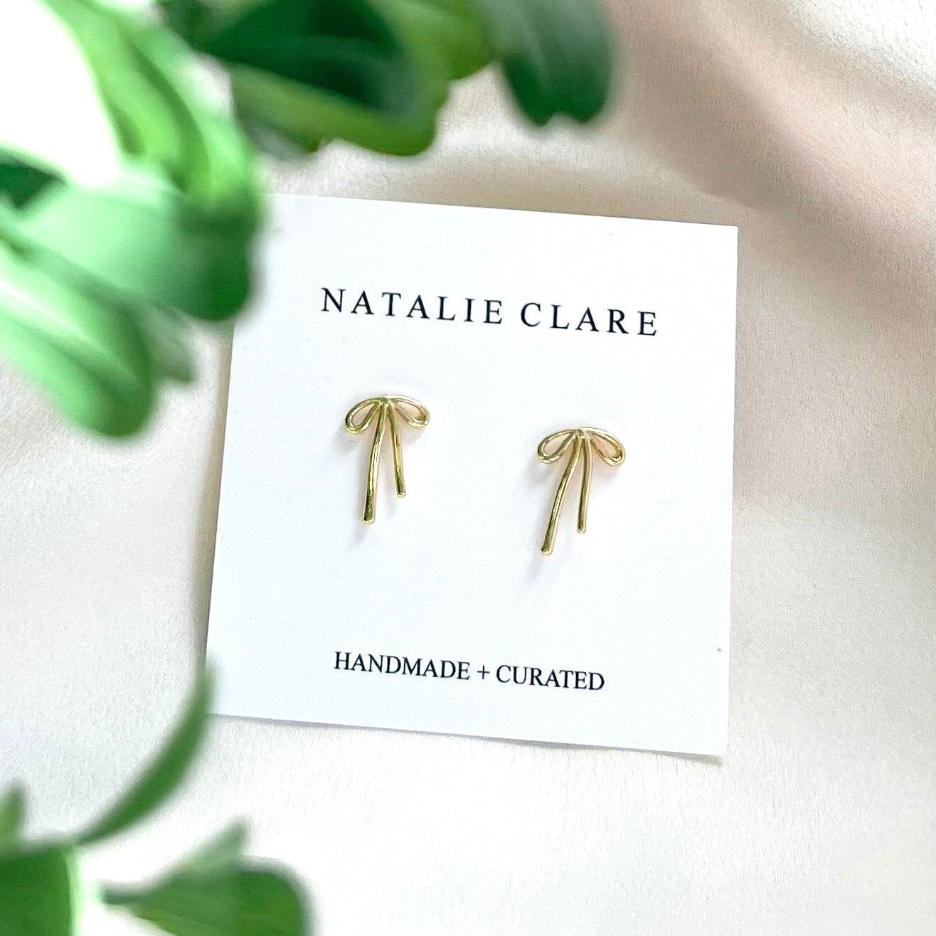 Golden Bow Stud Earrings from Natalie Clare