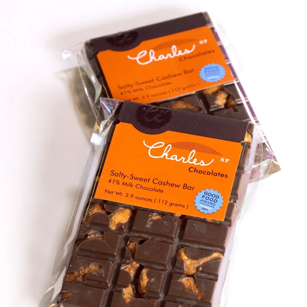 Two chocolate bars with orange packaging featuring 'Charles Chocolates' branding on a white background.