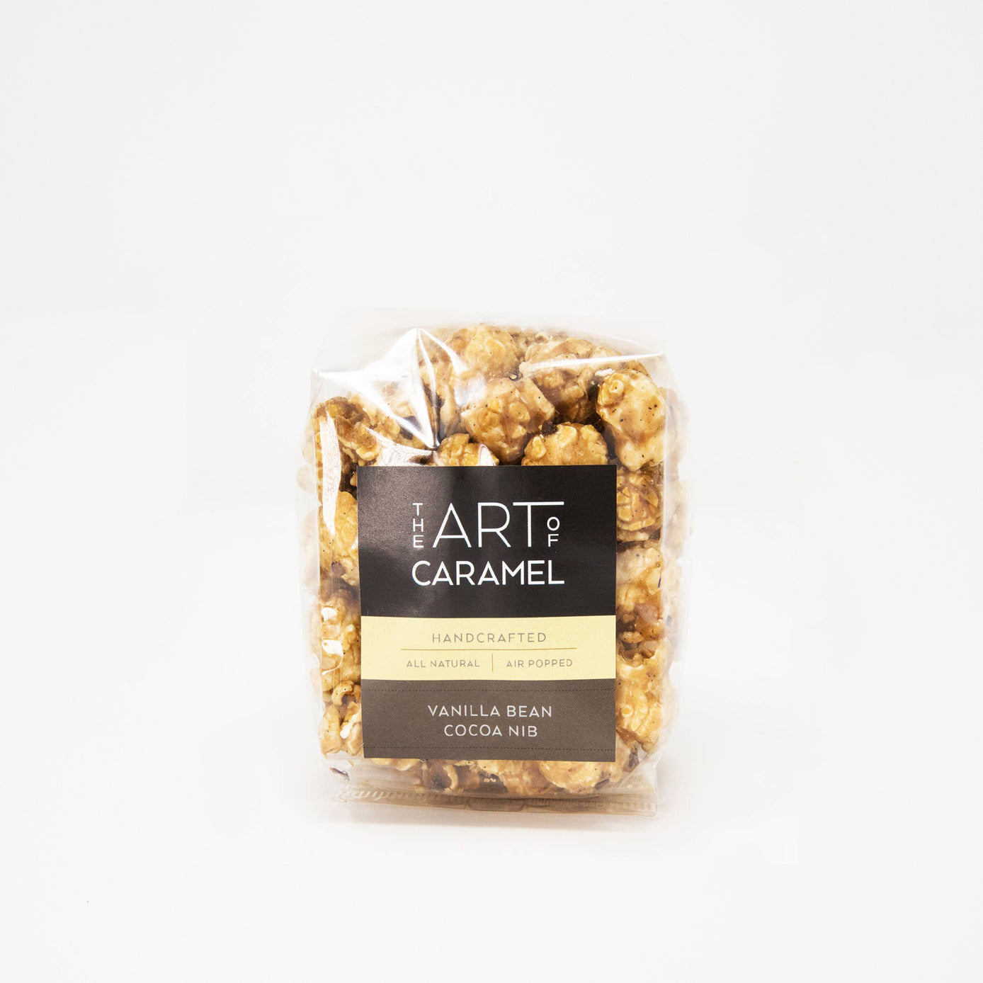 Packaged caramel popcorn with 'The Art of Caramel' label on a white background