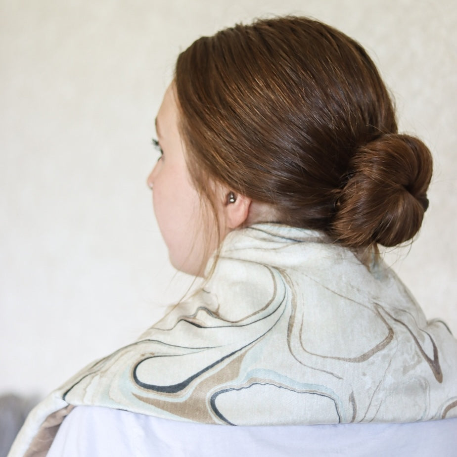 Wholesale Heatable Therapy Spa Wrap- Celestial Spa on a woman's shoulders
