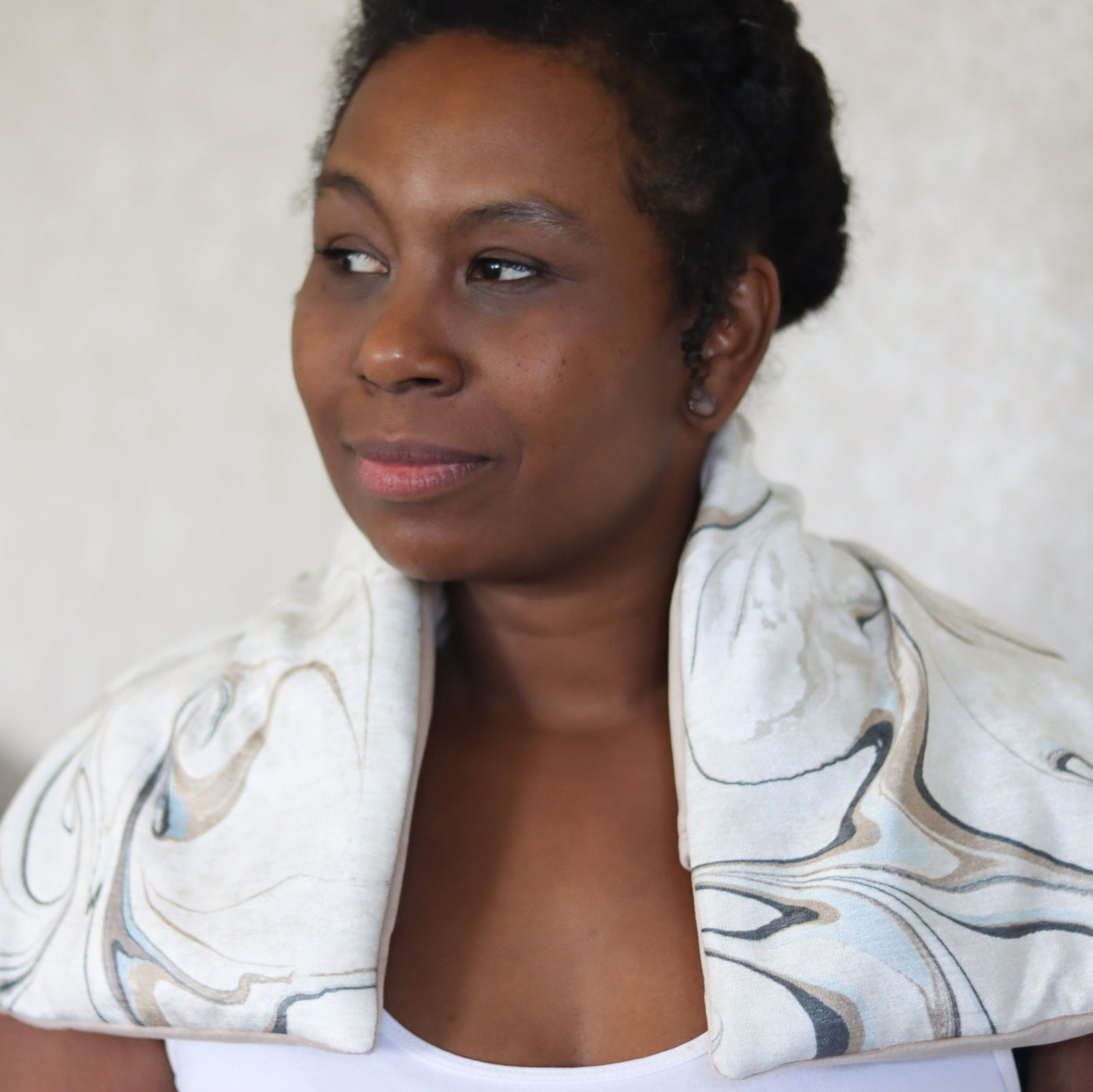 Wholesale Heatable Therapy Spa Wrap- Celestial Spa on a woman's shoulders