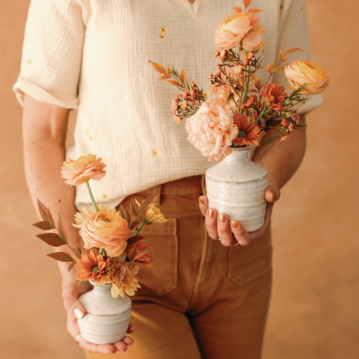 Meg Blancato holds bud vases from Native Poppy
