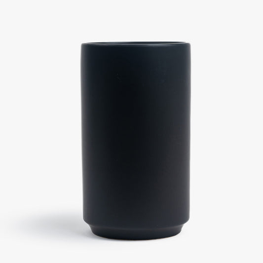 Black cylindrical vase on a white background