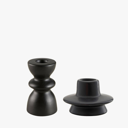 Two black candle holders on a white background