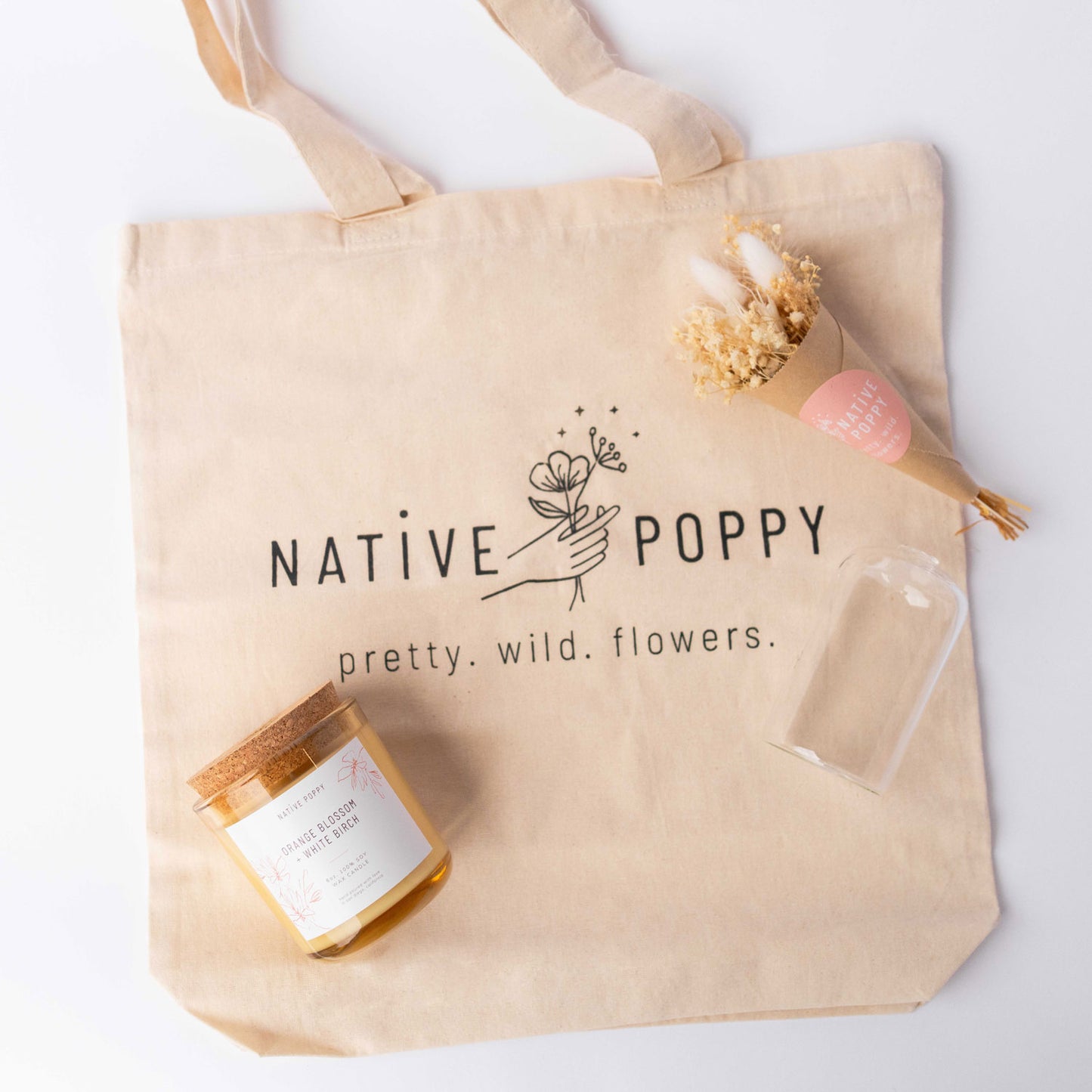 Contents of Native Poppy Signature Gift Box - tote bag, candle, dried flowers, and vase