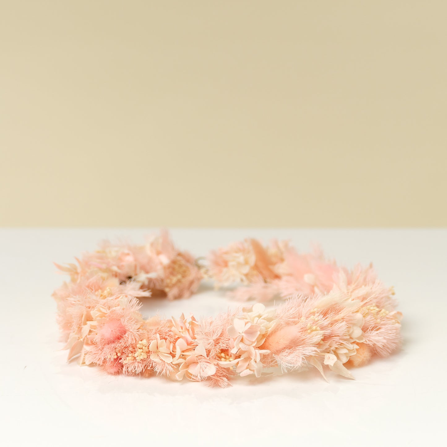 Dried flower crown made with peach and pink flowers from Native Poppy