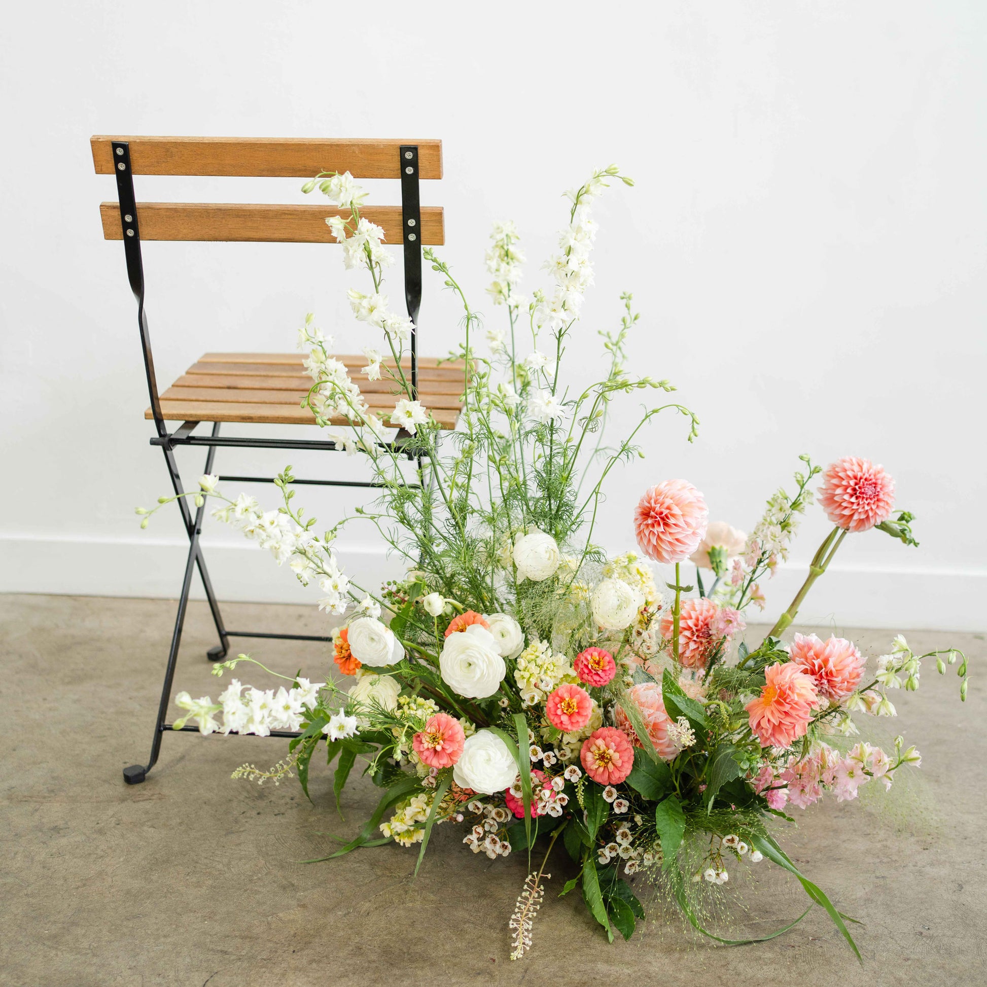 Wildflower Meadow Aisle Marker in front of folding chair