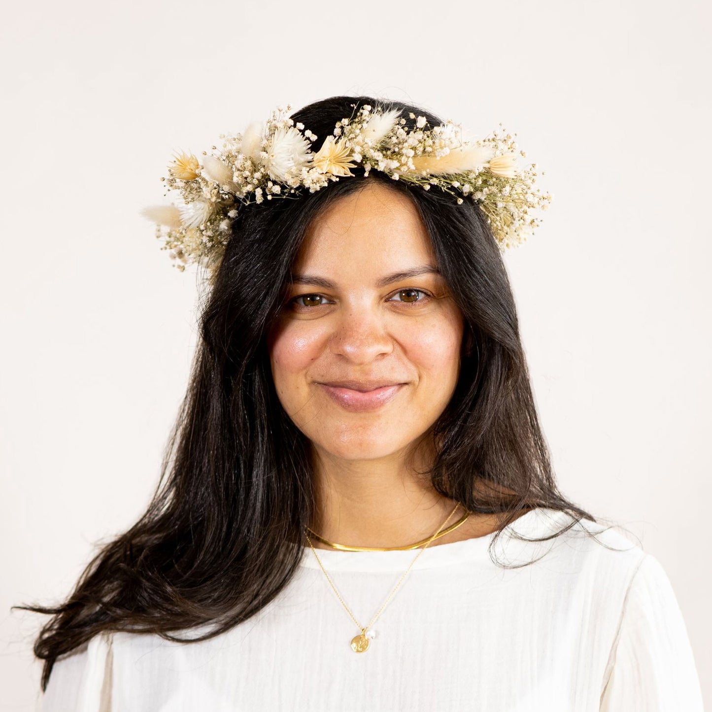Dried flower crown worn by a woman with dark hair