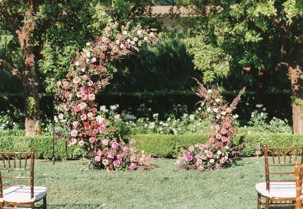 Crescent moon floral arch in garden wedding