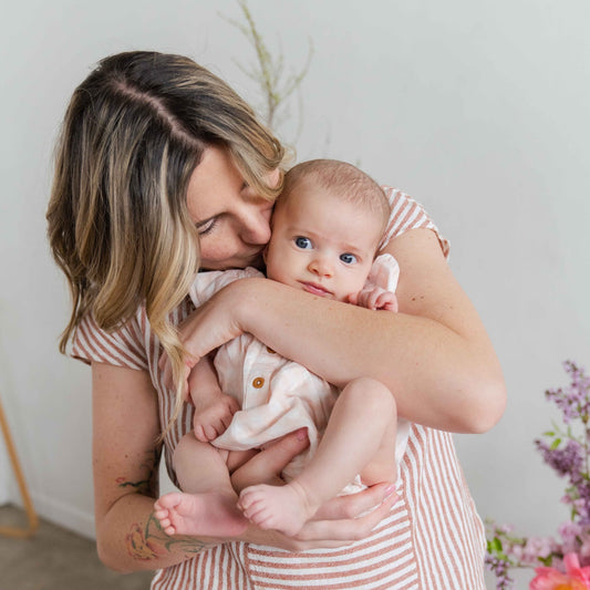 Native Poppy owner Natalie Gill kissing her baby Hazel