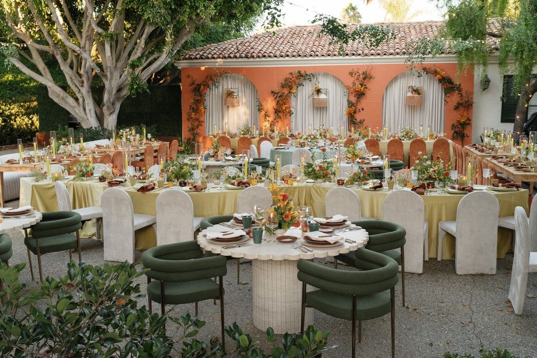 Wedding reception with tables in Spanish courtyard setting