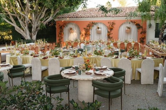 Wedding reception with tables in Spanish courtyard setting