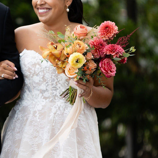 Bride holding wedding flower bouquet