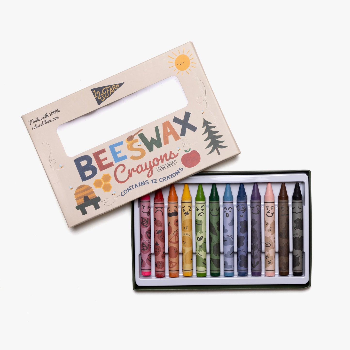 Set of beeswax crayons in a box with a colorful label on a white background