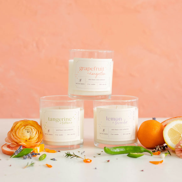 Wild Flower Club Scented Candles from Native Poppy surrounded by citrus and florals
