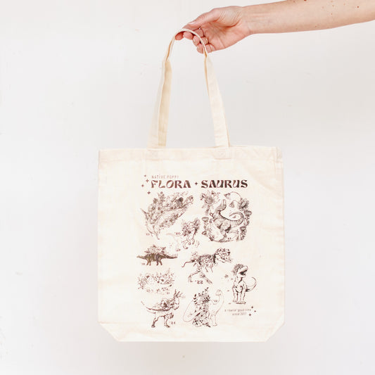 Florasaurus illustrated tote bag from Native Poppy held in front of a white background
