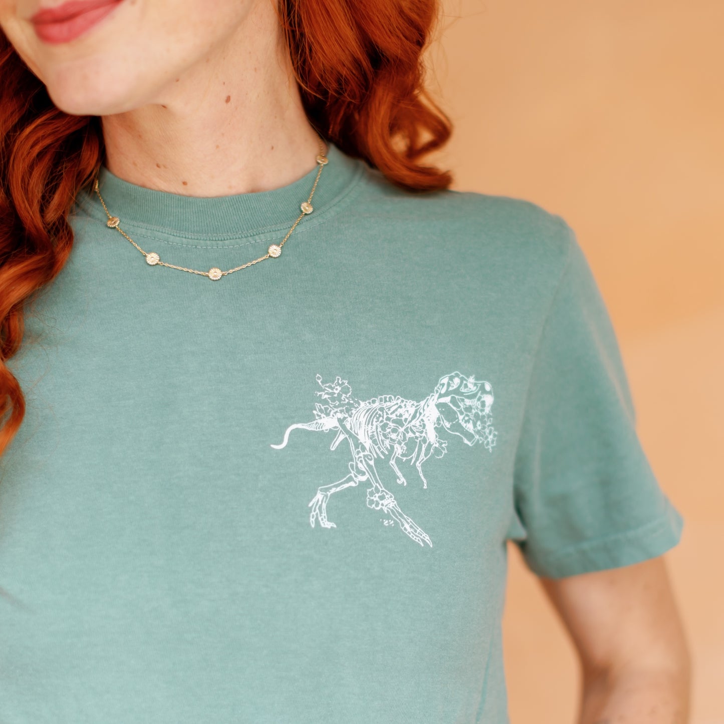 Chest detail of Native Poppy's 2026 florasaurus tee