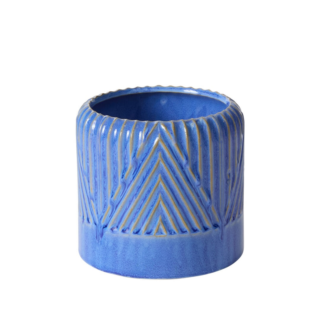 Blue ceramic planter with geometric pattern on a white background