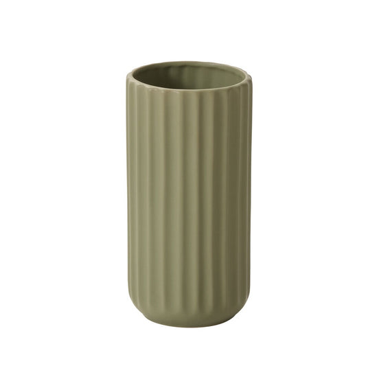 Green ribbed vase on a white background