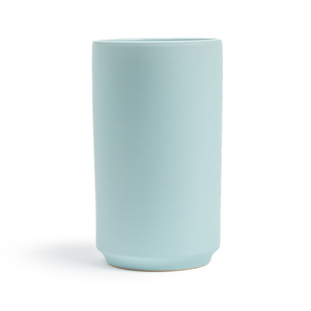 Light blue ceramic vase on a white background