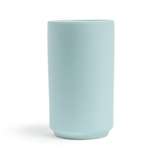 Light blue ceramic vase on a white background