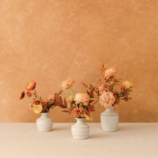 Thanksgiving flowers arranged in ceramic bud vases from Native Poppy