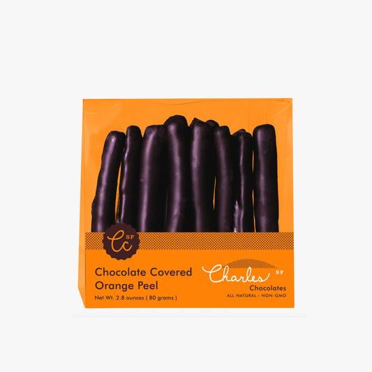 Packaged chocolate-covered orange peel with Charles Chocolates branding on an orange background