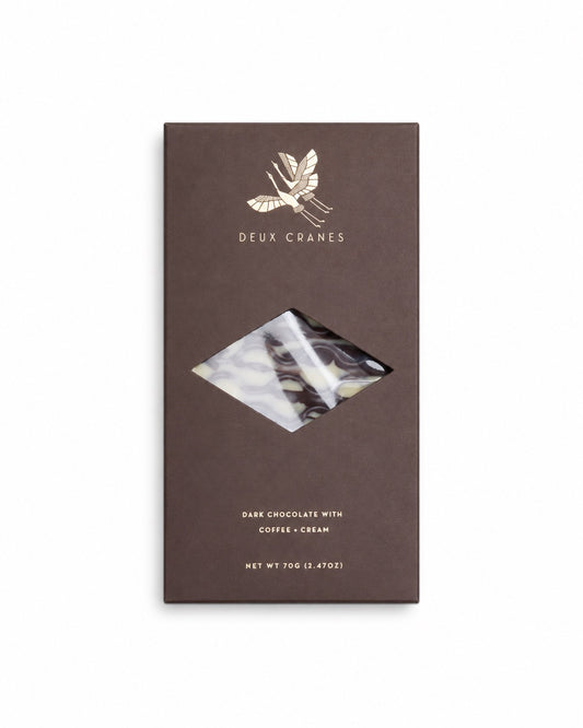 This chocolate bar is an homage to the warm and cozy feeling a steaming cup of coffee and cream evokes.