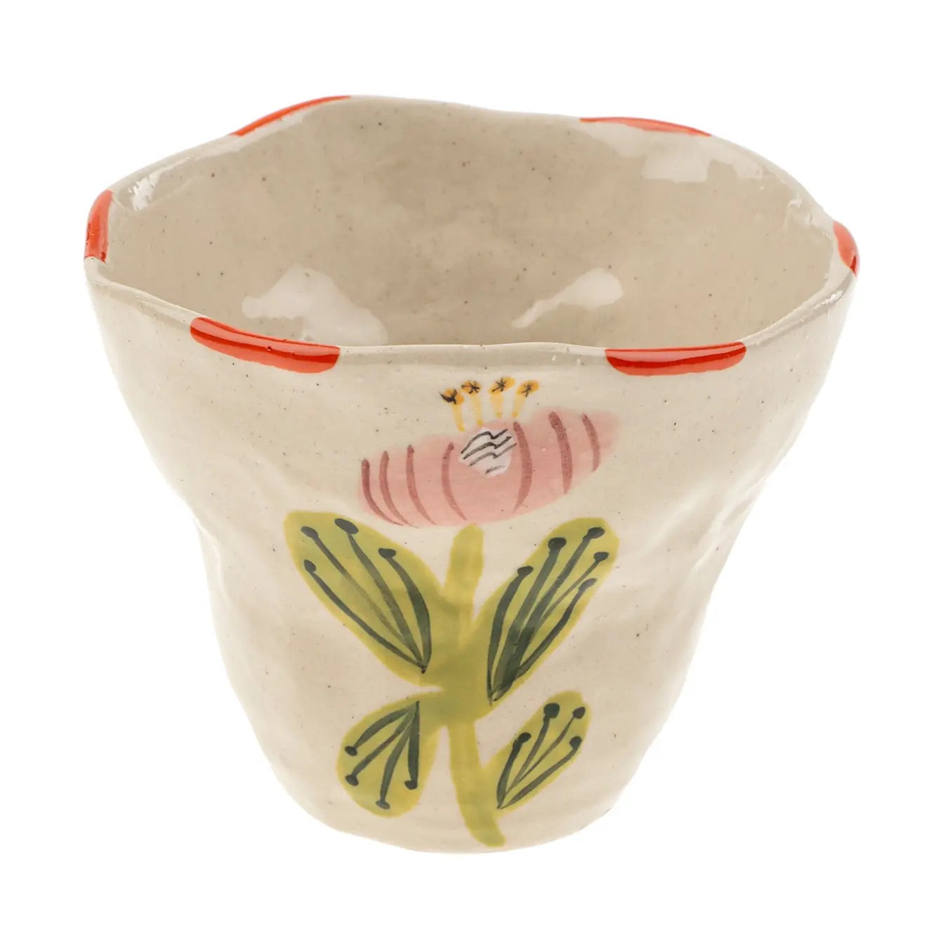 Add a playful touch to your dinnerware collection with the Flora Pottery Cup. Made from hand-formed stoneware and hand painted with a vibrant floral motif, each cup is a one-of-a-kind expression of traditional crafting methods. 