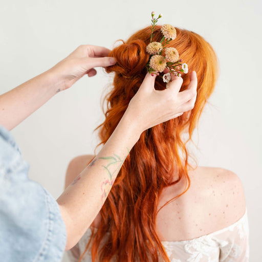 Hair Flower Pins from Native Poppy added to a redhead's hair