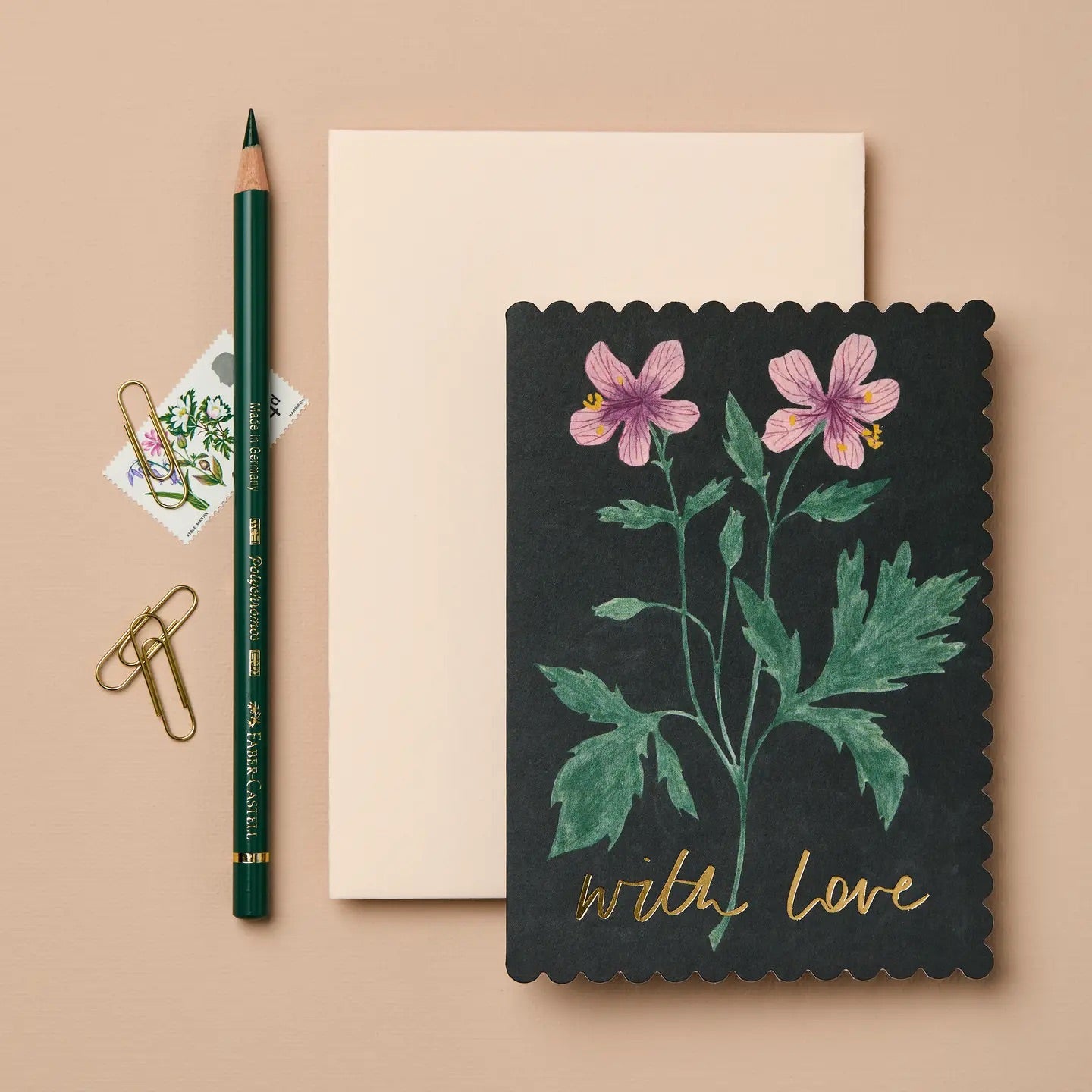 A new addition to our Flora collection, this inky black card has taken inspiration from vintage botanical drawings. It features a die cut scalloped edge, beautiful floral illustration and golden foil on the front and back of the card. 
