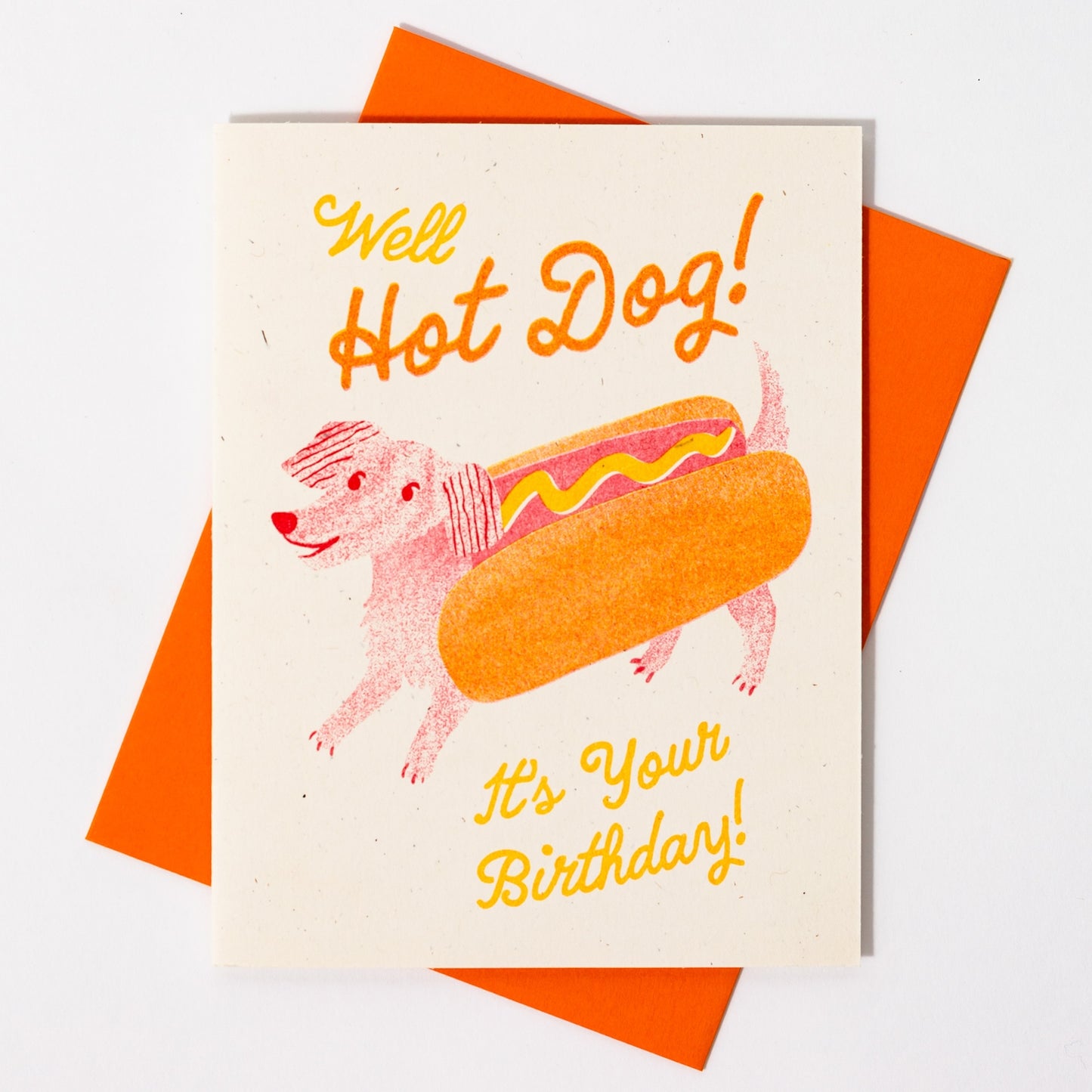 Birthday card with a dog in a hot dog costume and 'Well Hot Dog! It's Your Birthday!' text.