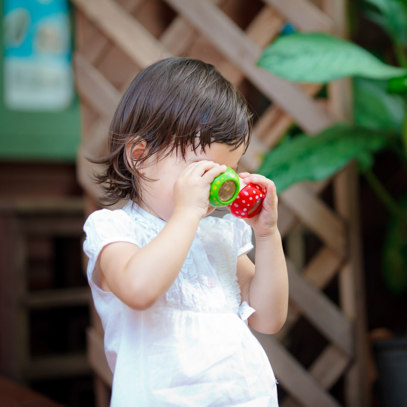 Child playing with Mushroom Kaleidoscope toys