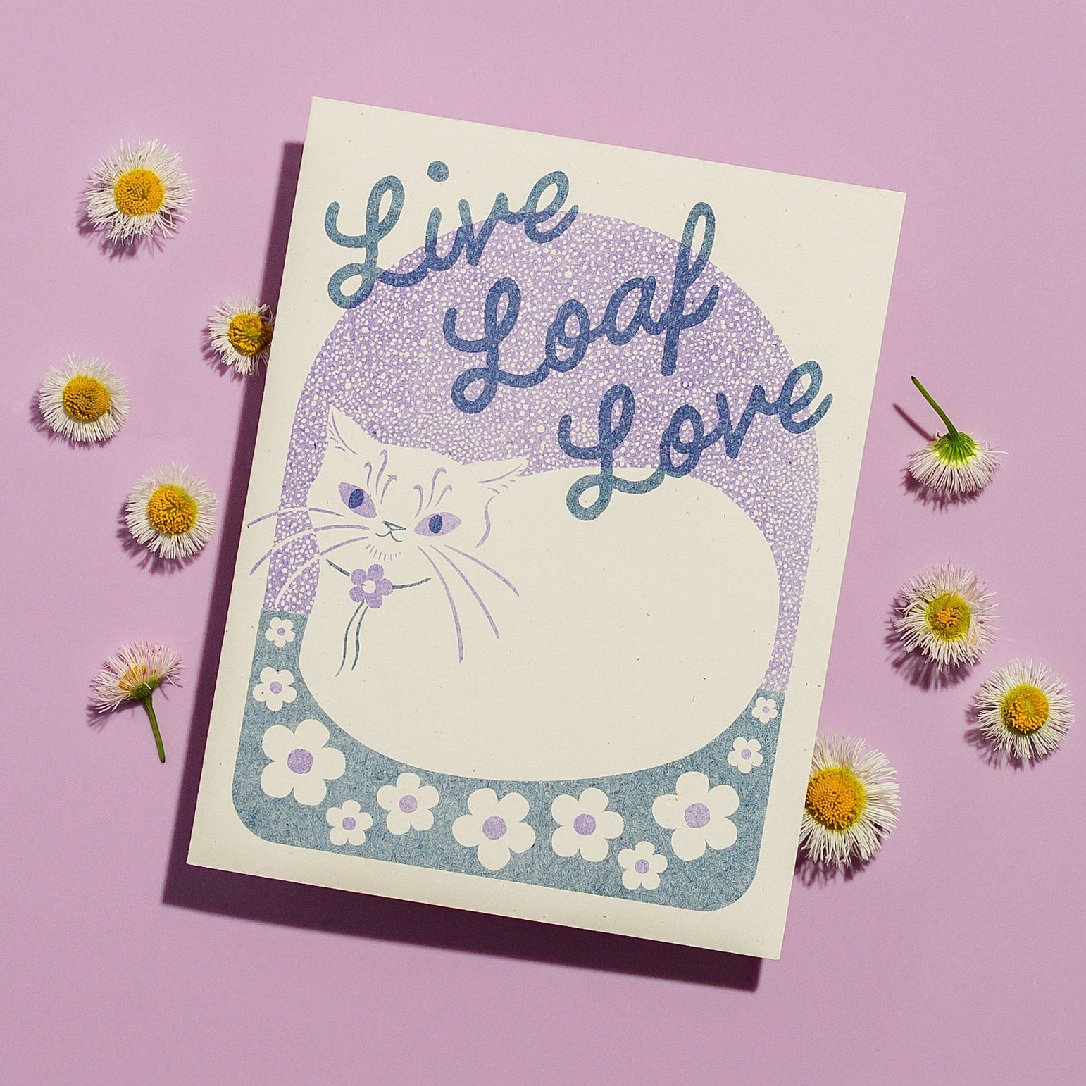 Card with a cat illustration and 'Live Loaf Love' text on a purple background with flowers.