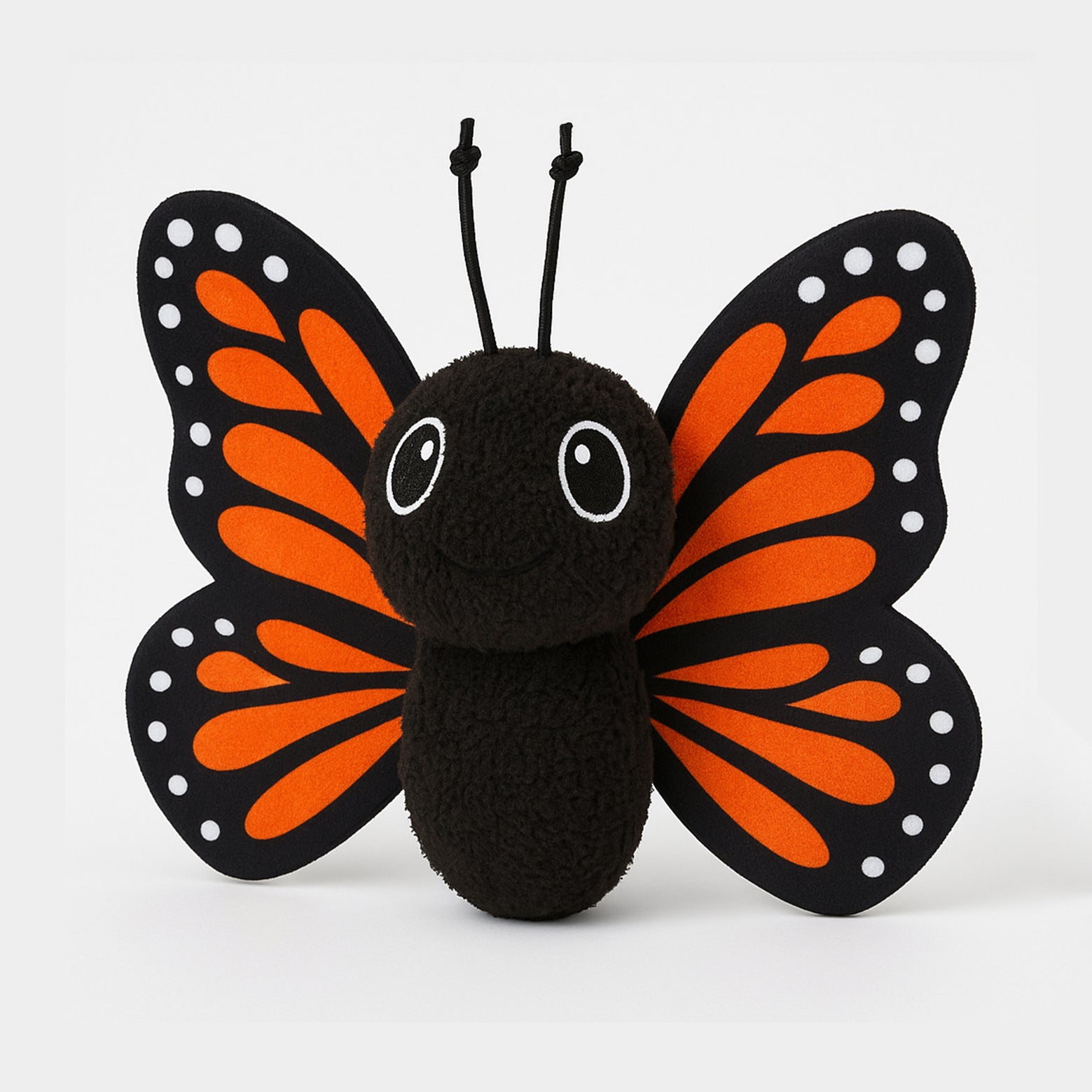 Plush butterfly toy with black and orange wings on a white background