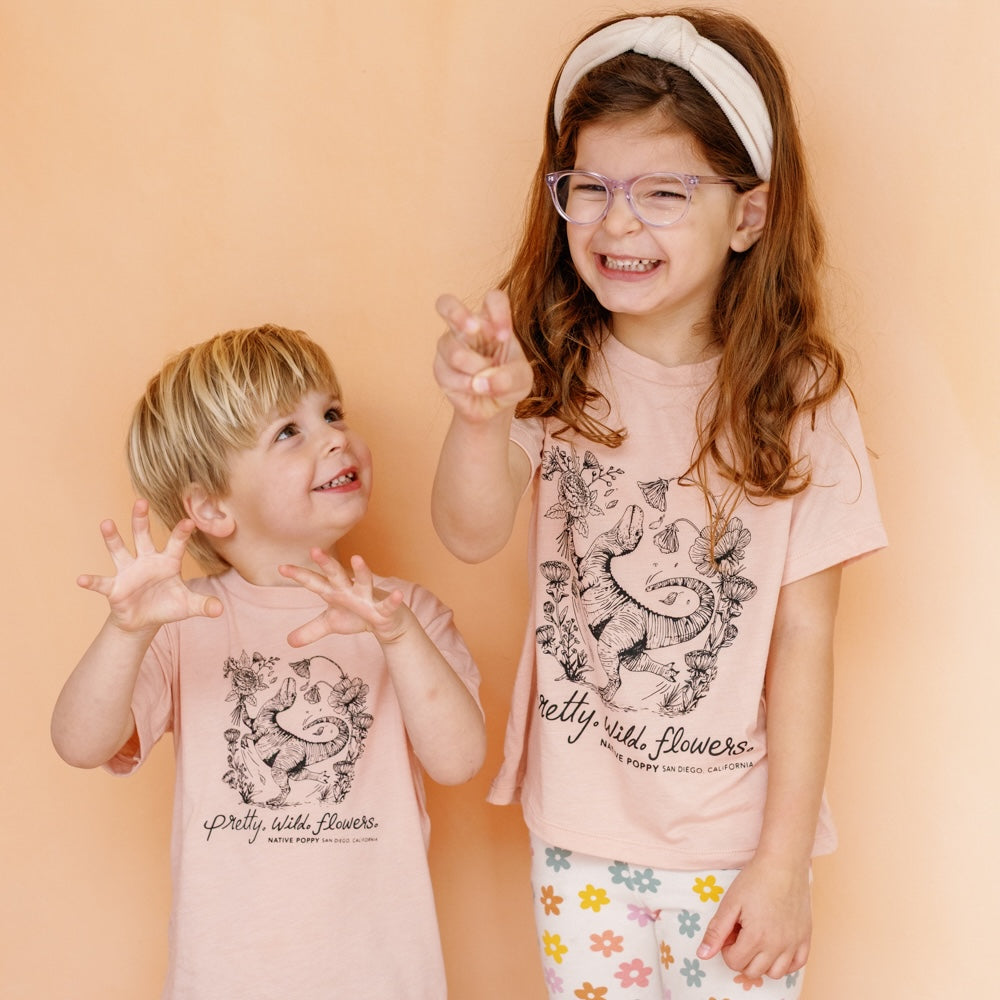 Two young children wearing florasaurus toddler tees