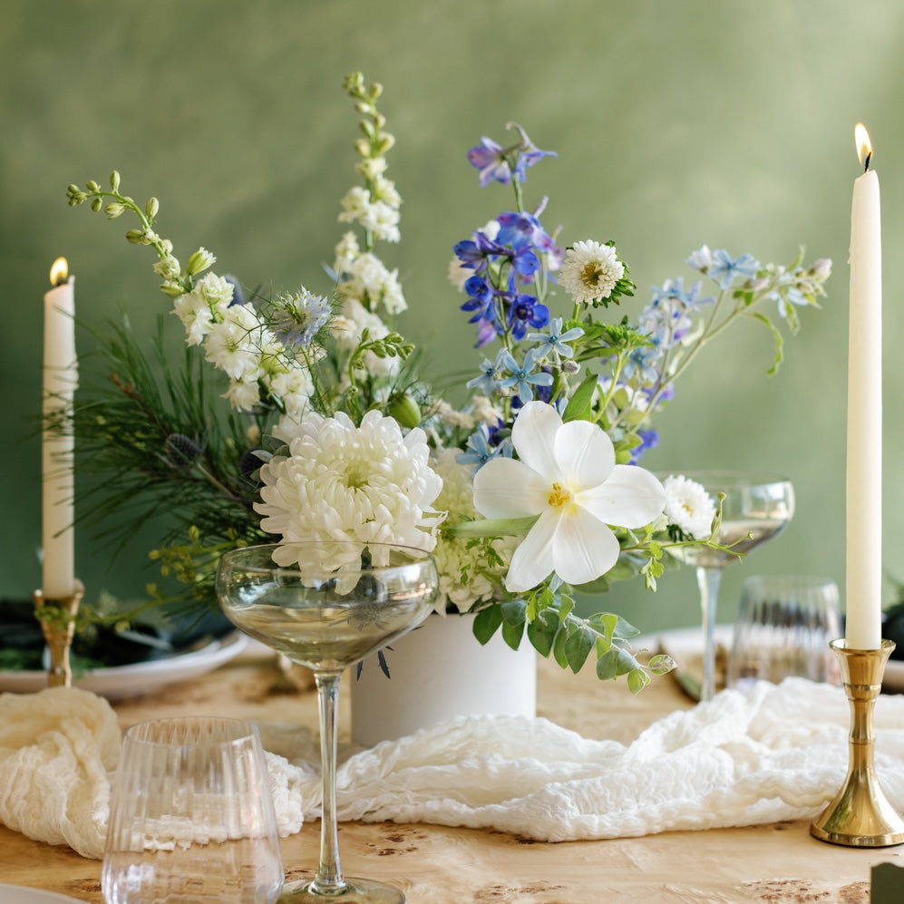 Holiday flower arrangement from Native Poppy on a dining table