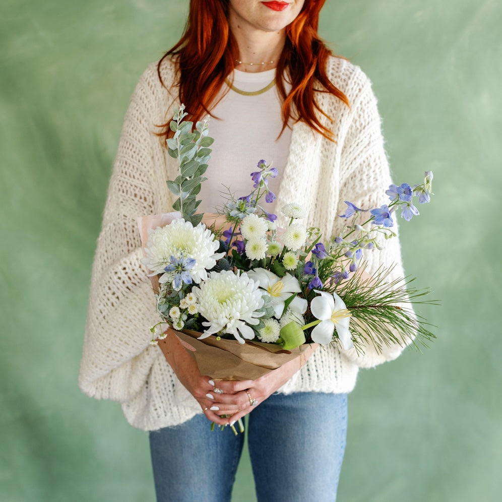Meg holds "Snowball Blooms" Holiday flowers from Native Poppy